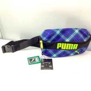 Puma Rhythm hip sack/ fanny pack color; navy,green and black plaid .